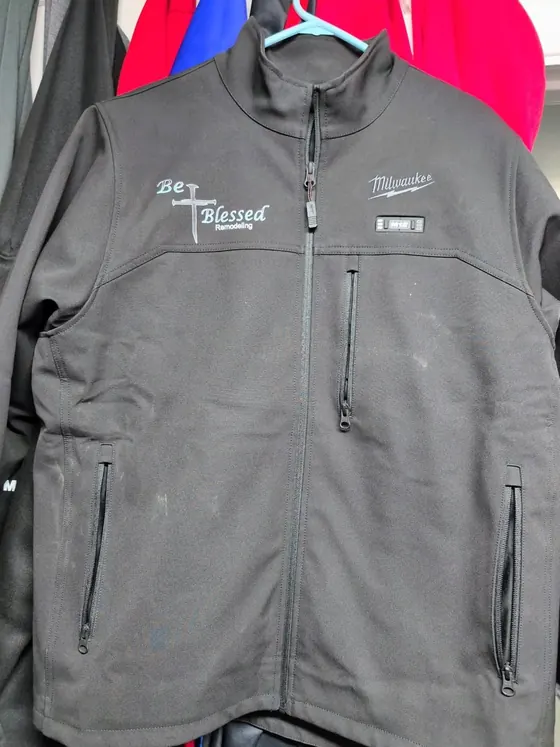 Gray zip-front work jacket personalized with the Be Blessed Remodeling logo on the chest.