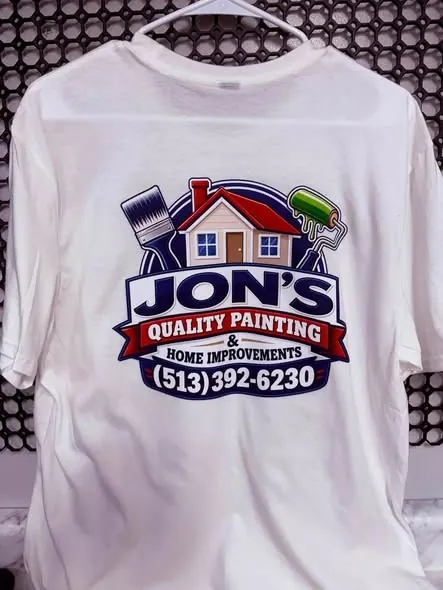 White T-shirt printed with Jon’s Quality Painting and Home Improvements logo.